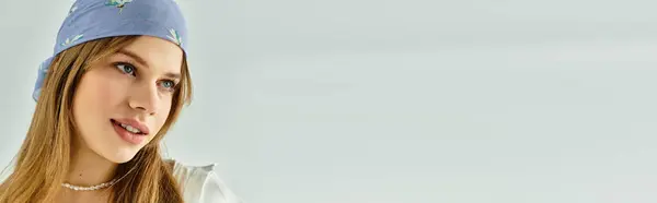 A fashionable young woman expresses the essence of spring with her stylish outfit in the studio, banner — Stock Photo