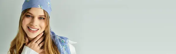A young woman showcases her spring outfit with a playful demeanor against a neutral backdrop, banner — Stock Photo