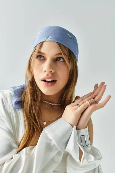 A stylish young woman showcases her spring outfit in a vibrant studio, radiating youthful energy. — Stock Photo