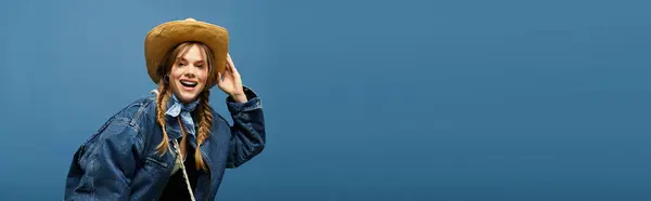A vibrant young woman poses in a denim jacket and cowboy hat, radiating spring energy, banner — Stock Photo
