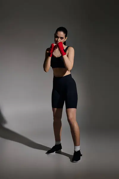 Young athletic female warrior gets ready to train, showcasing strength and determination in focus — Stock Photo