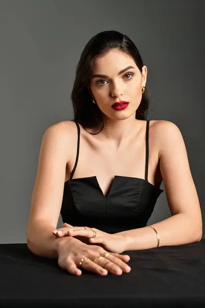 Beautiful woman with brown hair and red lips exudes confidence in an elegant setting. — Stock Photo