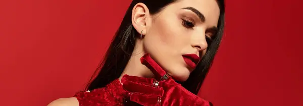 In a stunning studio, a young woman flaunts radiant red lips and elegant attire, banner — Stock Photo