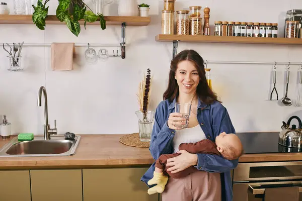 A loving mother shares a tender moment with her child in a warm and inviting kitchen. — Stock Photo