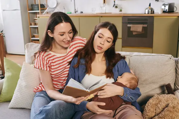 Two joyful mothers share a peaceful Mothers Day together, reading and cherishing their little one. — Stock Photo