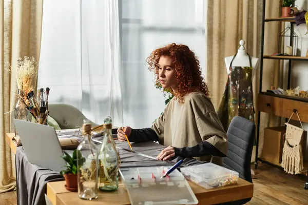 Young beautiful woman engaged in a DIY project, thoughtfully designing in her creative workspace — Stock Photo