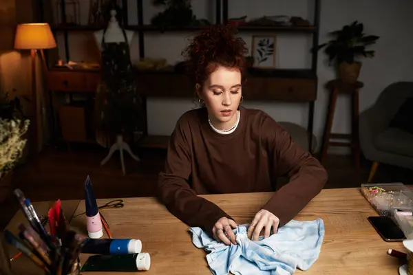 A talented young woman creates a unique DIY project in her cozy, modern craft space. — Stock Photo