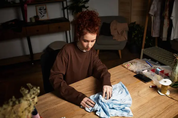 A young woman focuses on her craft project, enjoying the process in her stylish workspace. — Stock Photo