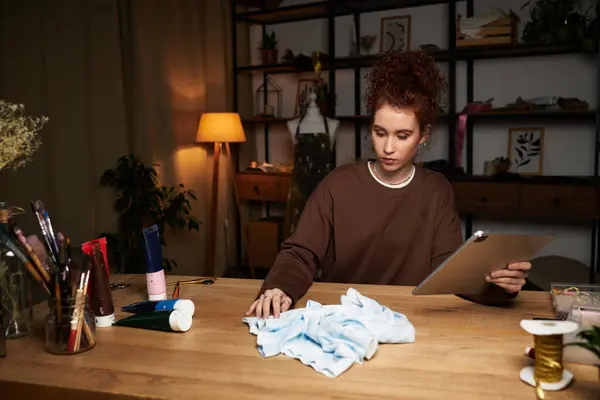 A skilled craftswoman immersed in her DIY activity, crafting and designing in a cozy room. — Stock Photo