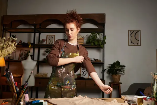 Talented craftswoman engaging in a hands on project surrounded by plants and creative materials — Stock Photo