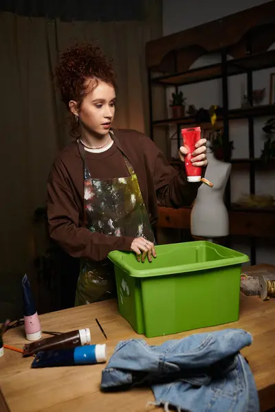 A talented young woman passionately engages in DIY projects with colorful materials around her. — Stock Photo