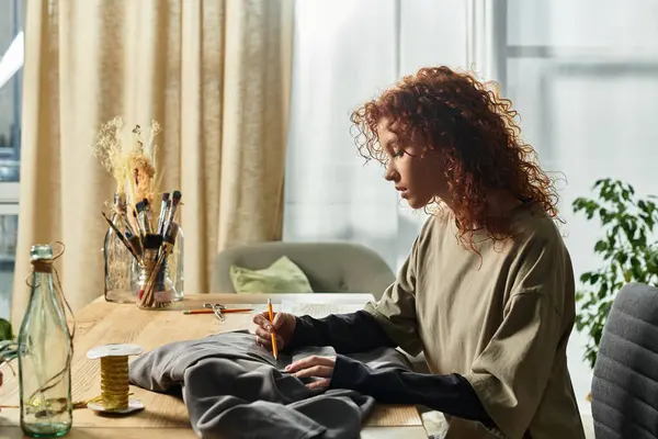 Creative young woman engages in DIY crafting, designing unique fabric pieces with focus and skill. — Stock Photo