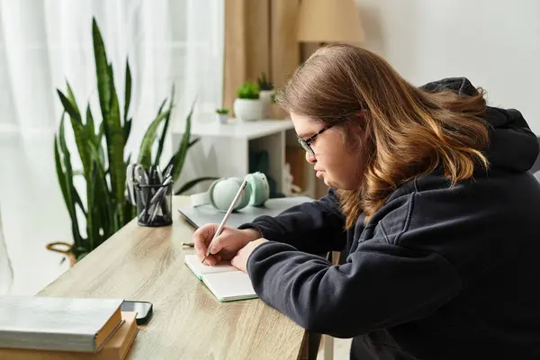 A young woman with Down syndrome writes in a cozy corner, radiating warmth and confidence. — Stock Photo