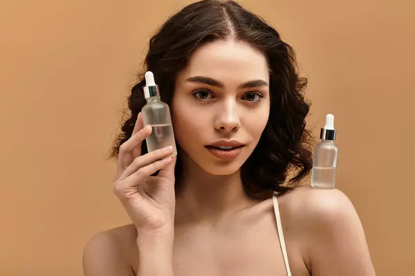 Pretty young woman with braces demonstrates her beauty skincare routine using elegant products. — Stock Photo
