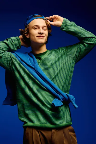 Stylish young man in trendy attire strikes a playful pose, embodying contemporary youth culture. — Stock Photo