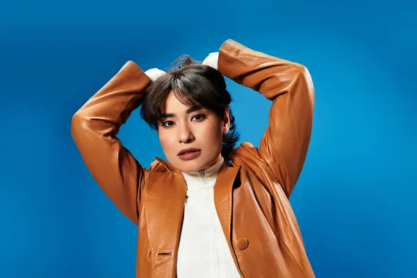 A stylish young Asian woman exudes confidence with her bold pose and striking expression. — Stock Photo