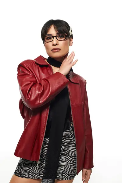 Confident young Asian woman in a bold red jacket shows off her unique style. — Stock Photo