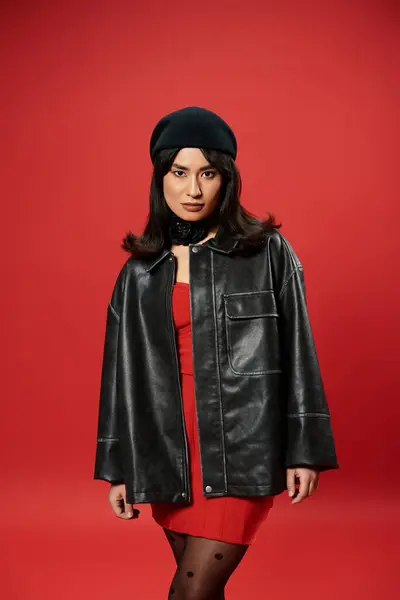 Stylish young asian woman stands confidently in trendy attire, bringing modern charm to life. — Stock Photo