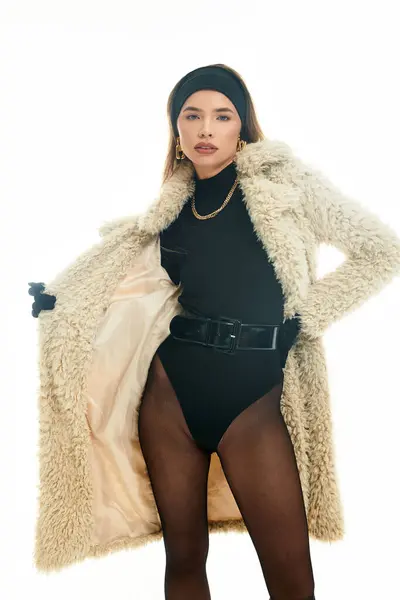 Beautiful young woman presents a bold fashion statement with confidence and grace indoors. — Stock Photo