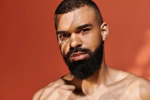 Handsome man displays unique style and character, highlighted by shadows on his facial features. — Stock Photo