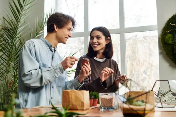 Loving couple chatted enthusiastically while creating artistic pieces together. — Stock Photo
