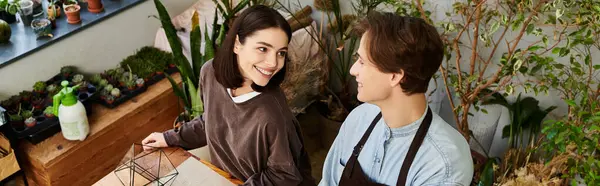 Creative couple discuss creative concepts while exploring various art supplies. — Stock Photo