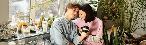 Couple finds joy and creativity in a lively art studio filled with plants and supplies. — Stock Photo