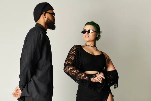 A stylish young couple flaunts unique sunglasses, celebrating diversity in fashion. — Stock Photo