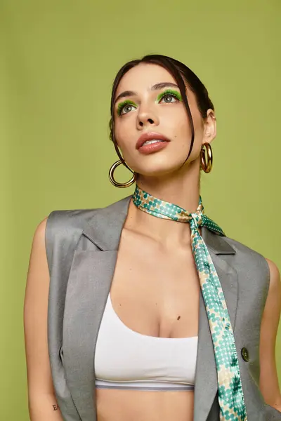 A stunning young woman shows off her unique fashion style with bold makeup and a modern look. — Stock Photo