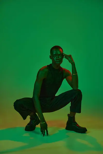 A confident young african american man shows off his unique style in an artistic setting. — Stock Photo