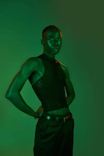 A stylish young African American man poses confidently in trendy attire. — Stock Photo