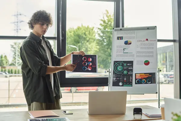 Professional engages colleagues with charts and data during a meeting in a bright office space — Stock Photo