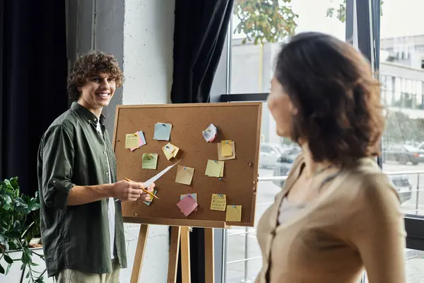 Two professionals engage in a creative discussion, surrounded by colorful notes and ideas. — Stock Photo