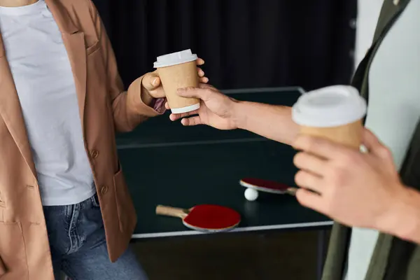 Colleagues enjoy coffee together while sharing ideas in a relaxed office environment. — Stock Photo