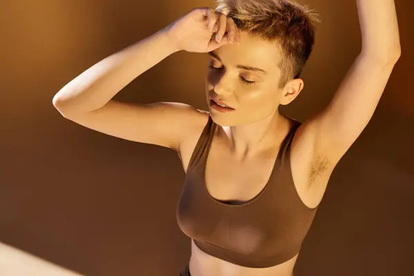 A young woman radiates confidence and beauty under warm sunlight, showcasing body positivity. — Stock Photo
