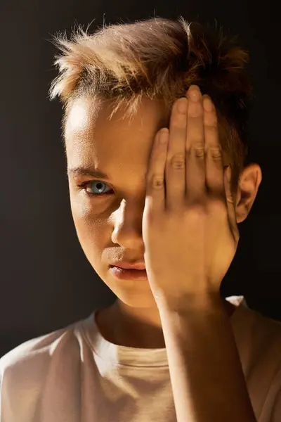 A boy with striking features showcases his confidence through self expression and creativity. — Stock Photo