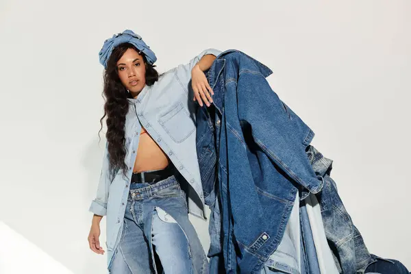 Young woman embraces a vibrant summer look with layered denim and bold fashion choices. — Stock Photo