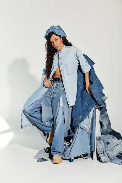 Young woman confidently models a variety of denim outfits in a bright, stylish environment — Stock Photo