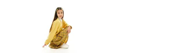 A young girl in a chic school uniform strikes a playful pose, highlighting her fashion sense, banner — Stock Photo