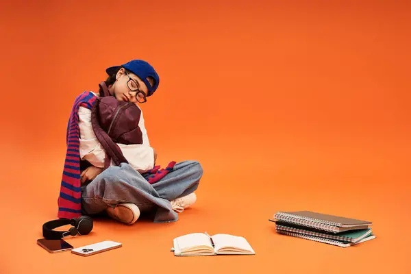Tired asian teenage girl showcases her unique style while exploring creativity in a colorful studio. — Stock Photo