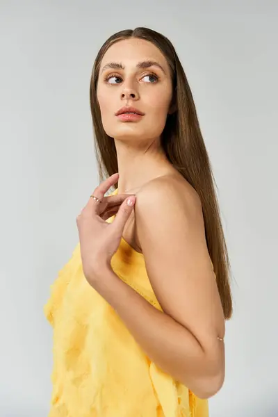 A young woman radiates summer beauty in vibrant fashion, immersed in self reflection. — Stock Photo