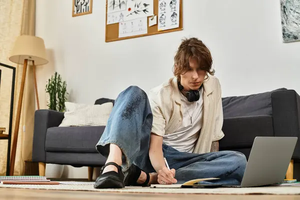 A student engages in focused study at home, surrounded by a creative and inviting atmosphere. — Stock Photo