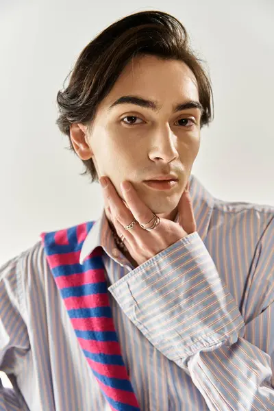 A stylish young non binary person poses confidently while expressing their identity. — Stock Photo