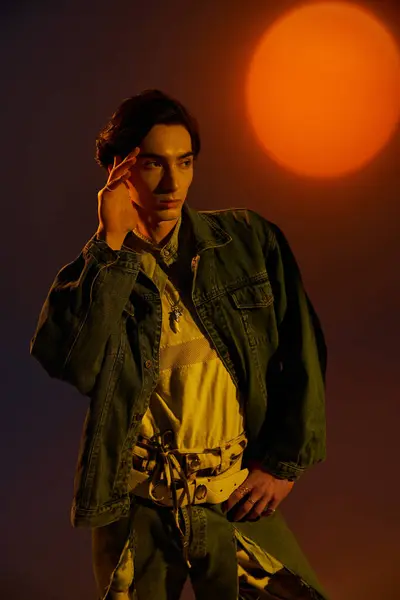 A confident non-binary person showcases their style against a warm sunset. — Stock Photo