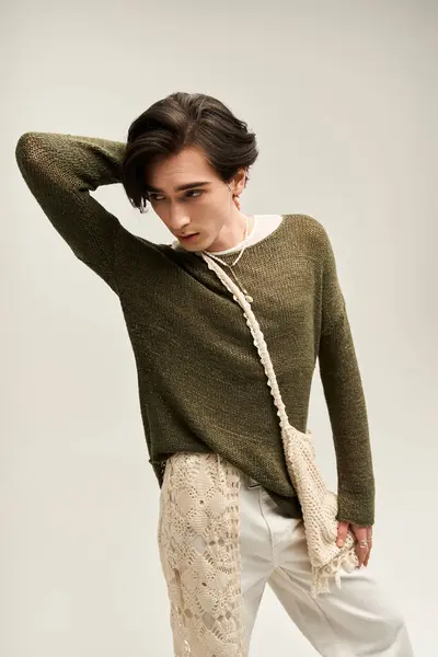 A young non binary individual showcases their unique fashion sense with confidence and pride. — Stock Photo
