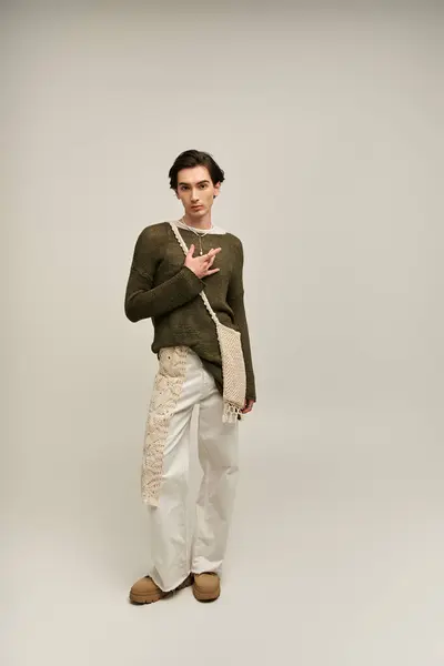 Young person expresses their identity with unique fashion choices and confident posture. — Stock Photo
