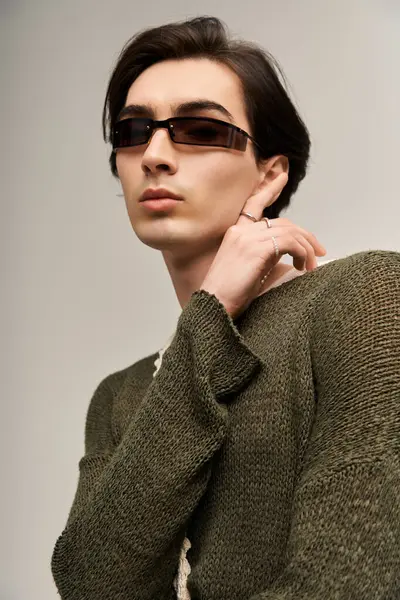 Young person showcases trendy fashion while embracing their unique identity, radiating confidence. — Stock Photo