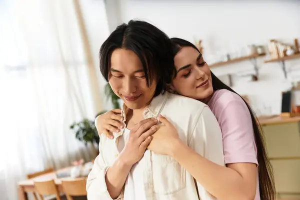 Couple enjoys a heartfelt embrace at home, showcasing their love and affection for each other. — Stock Photo