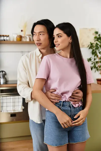 A loving couple shares an intimate moment at home, radiating affection and happiness together. — Stock Photo
