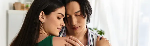 A couple embraces tenderly in their home, sharing a moment of love and connection. — Stock Photo